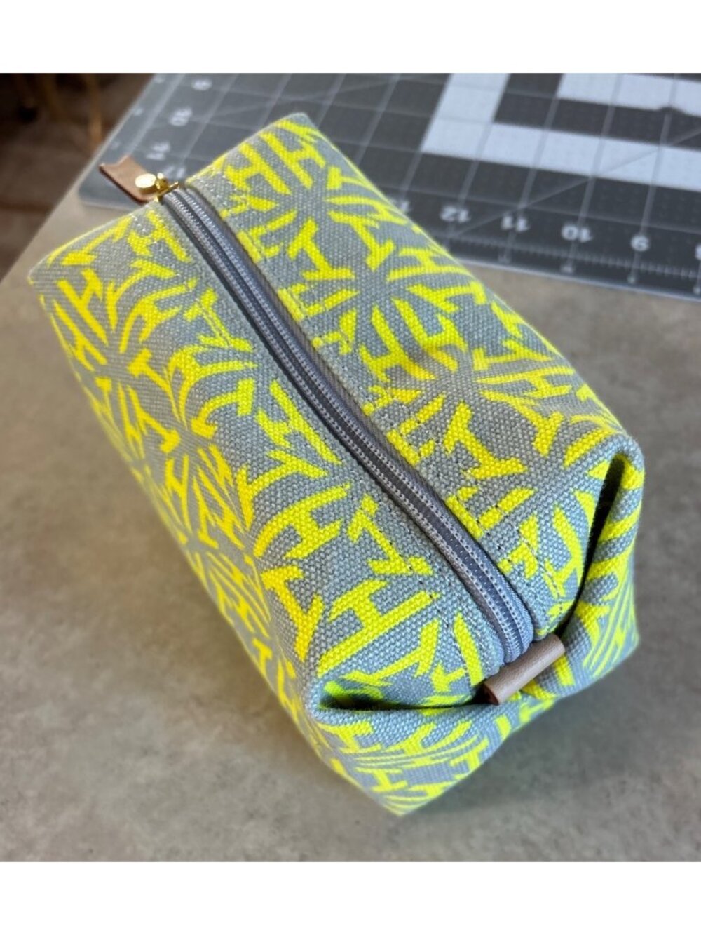 India Hicks Canvas Cosmetic Bag With Yellow & Gray Pattern Leather Zipper Pull